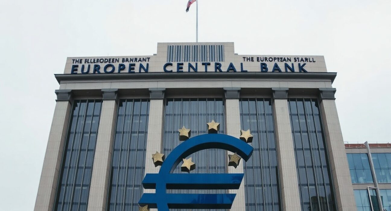 European Central Bank headquarters in Frankfurt with Euro symbol in foreground on a cloudy day