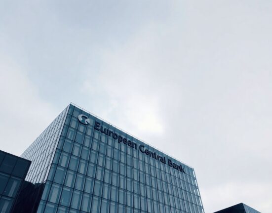 European Central Bank headquarters in Frankfurt under overcast sky, representing euro area monetary policy analysis.