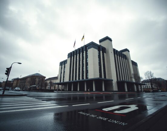 European Central Bank headquarters in Frankfurt under cloudy skies, symbolizing economic uncertainty
