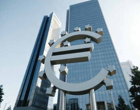 European Central Bank headquarters in Frankfurt with euro sculpture in foreground