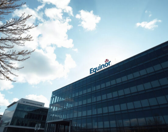 Equinor headquarters building in Stavanger, Norway, under a partly cloudy sky
