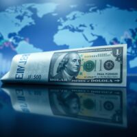 Euro and US dollar banknotes side by side, representing EUR/USD exchange rate dynamics.