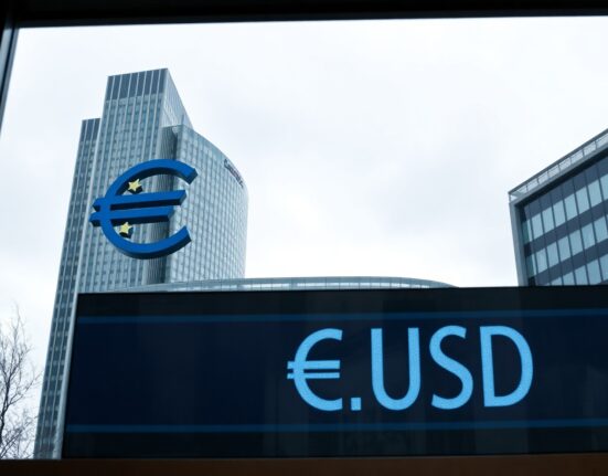 European Central Bank headquarters in Frankfurt on a cloudy day, representing eurozone monetary policy.