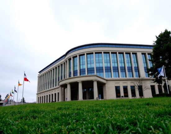 European Central Bank headquarters in Frankfurt under overcast sky