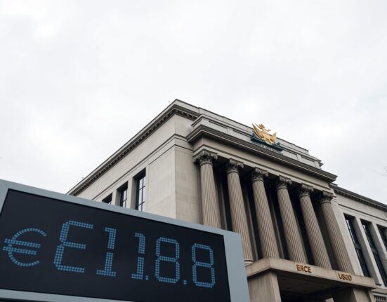 European Central Bank building in Frankfurt with EUR/USD exchange rate board showing flat trading