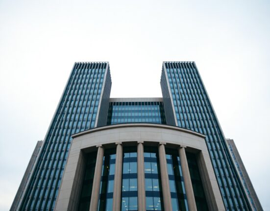 European Central Bank headquarters in Frankfurt under overcast sky, representing Eurozone monetary policy.