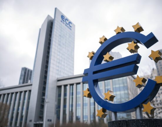 Euro sculpture in front of the European Central Bank in Frankfurt, symbolizing the currency's resilience amid PMI data.