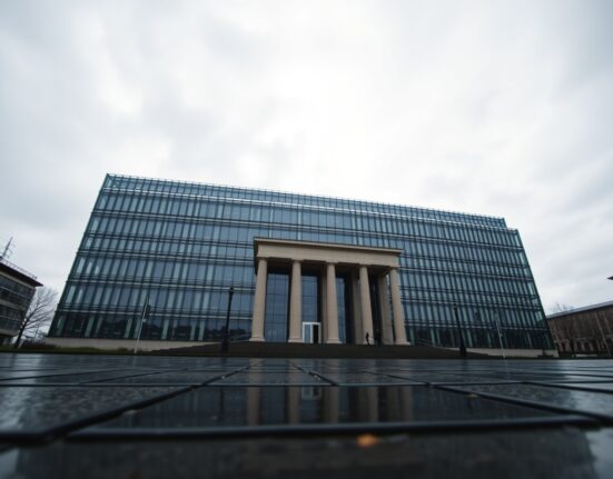 European Central Bank headquarters in Frankfurt with a subtle currency chart reflection on the pavement.
