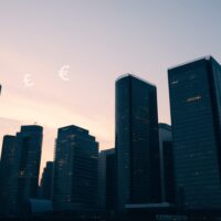 Financial district skyline at dusk representing currency market stability
