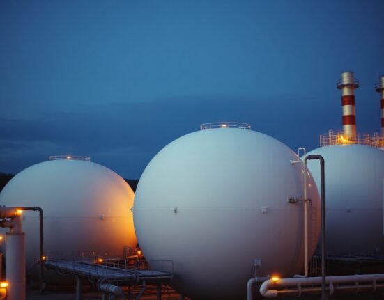 Natural gas storage facility in Europe at dusk, illustrating storage concerns.