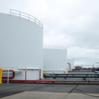 European natural gas storage facility with LNG terminal and pipelines under overcast sky