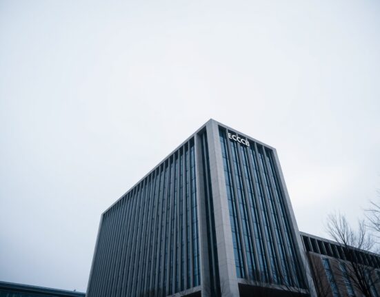 European Central Bank headquarters in Frankfurt, Germany, on a cloudy day.