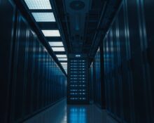 Interior of a data center with server racks and blue LED lights, representing AI model training infrastructure.