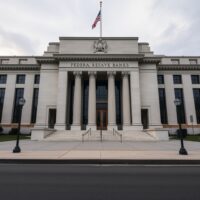 Federal Reserve Bank of Cleveland building exterior on a cloudy day, representing central bank policy stance.