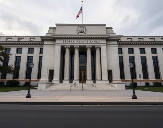 Federal Reserve Bank of Cleveland building exterior on a cloudy day, representing central bank policy stance.