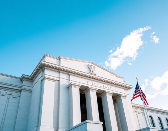 Federal Reserve building in Washington, D.C. on a clear day, representing monetary policy and interest rate decisions.