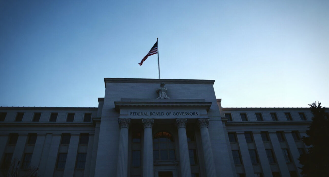 Federal Reserve building in Washington, D.C., with clear sky and evening light.