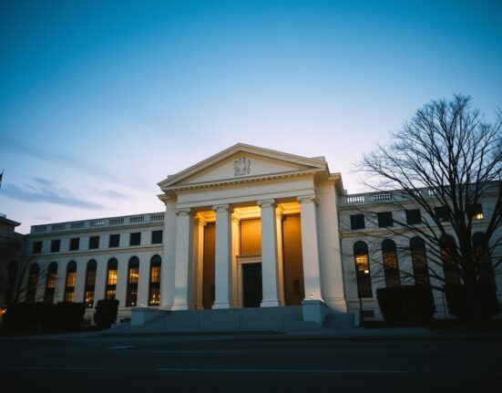 The Federal Reserve building representing the central bank's expected prolonged interest rate freeze through 2026.