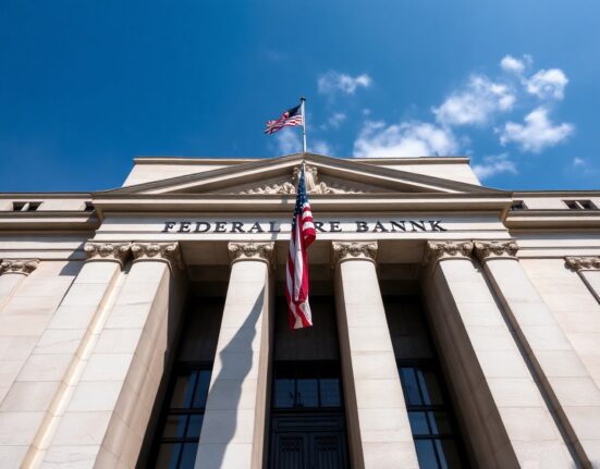 Federal Reserve Bank of New York building on a clear day, symbolizing monetary policy decisions.