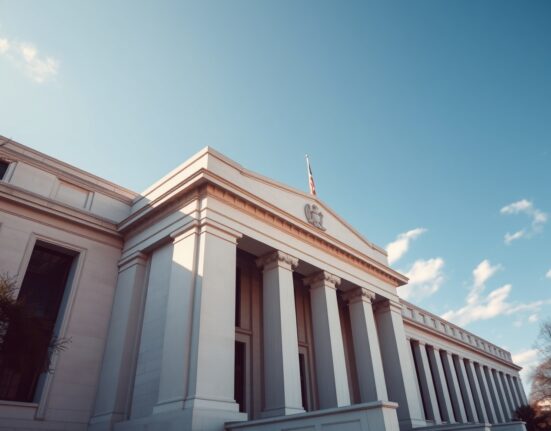 Exterior of the Federal Reserve building on a sunny day, representing central bank policy.