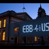 Bank of England building with GBP/USD exchange rate display showing impact of monetary policy decisions
