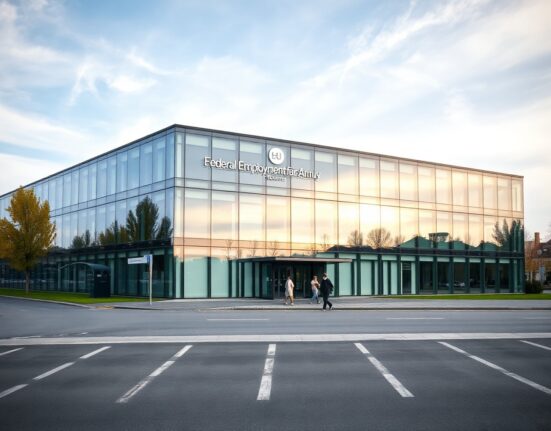Federal Employment Agency building in Nuremberg, Germany, on a cloudy day, with people entering the building.