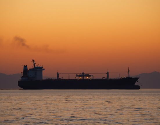 Oil tanker near blockaded Strait of Hormuz during Iran war, illustrating supply disruption and inventory depletion