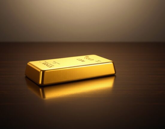 Gold bar on dark surface representing rising safe-haven demand after weak US jobs data