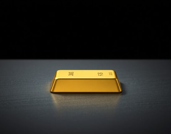 Gold bullion bar representing the sharp decline in gold price to a new yearly low.
