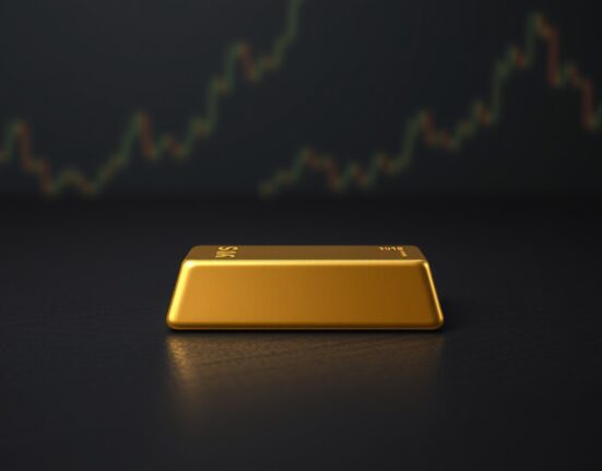 Gold bullion bar representing stable gold price amid Federal Reserve policy headwinds.