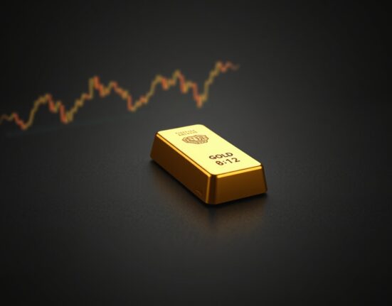 Gold bullion bar representing the sharp price drop following Trump's comments on Iran and the stronger US dollar.