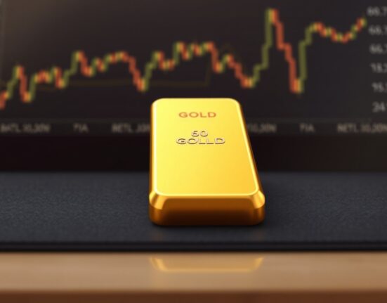 Gold bullion bar representing the safe-haven asset's rebound against Federal Reserve policy concerns.