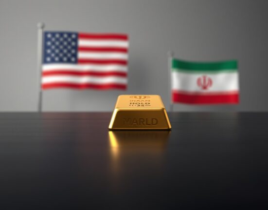 Gold bar on table with blurred US and Iranian flags in background, representing gold price recovery amid geopolitical tensions.
