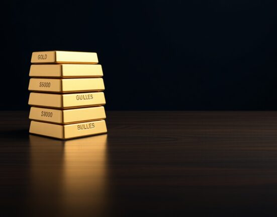 Gold bullion bars stacked on a dark surface, symbolizing gold price resilience amid a firmer USD