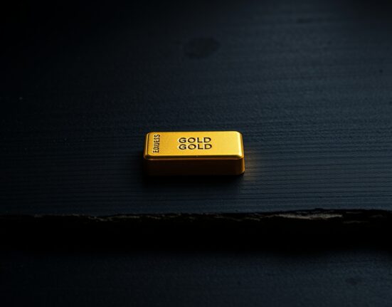 Gold bullion bar representing the safe-haven asset during market volatility, as analyzed by OCBC.