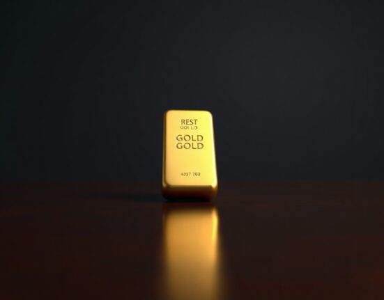Gold bar on dark surface representing precious metal market struggles