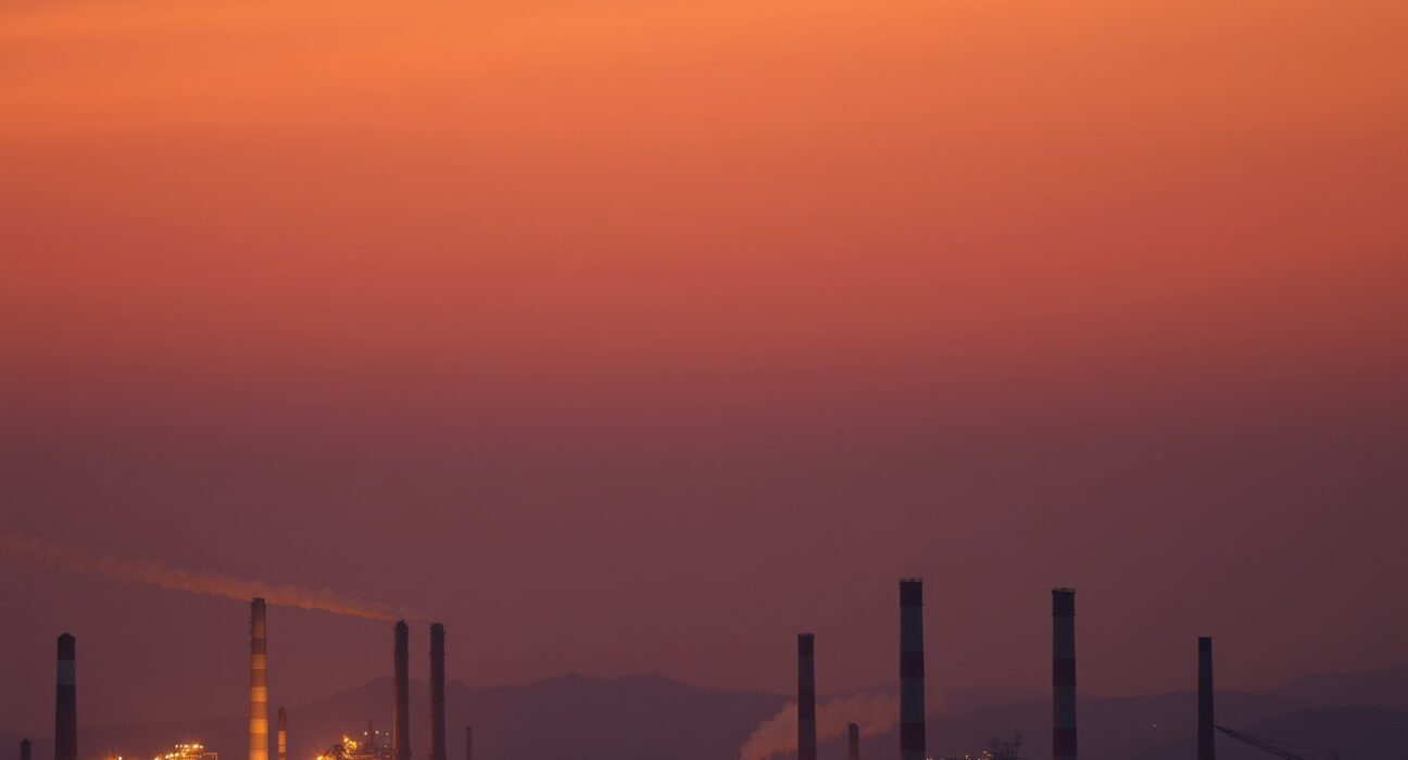 European industrial skyline at dusk symbolizing energy supply pressure and economic uncertainty