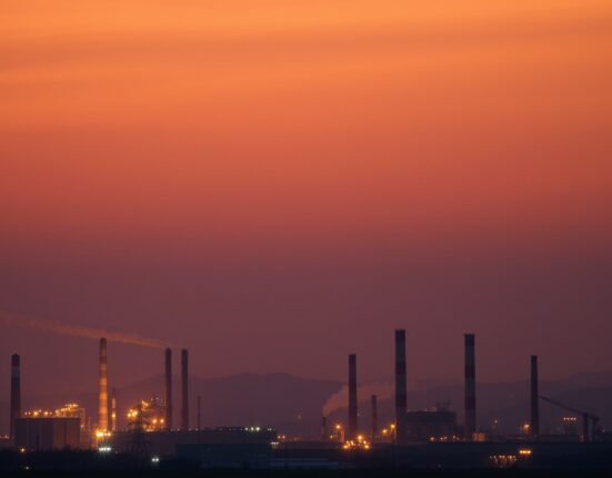European industrial skyline at dusk symbolizing energy supply pressure and economic uncertainty