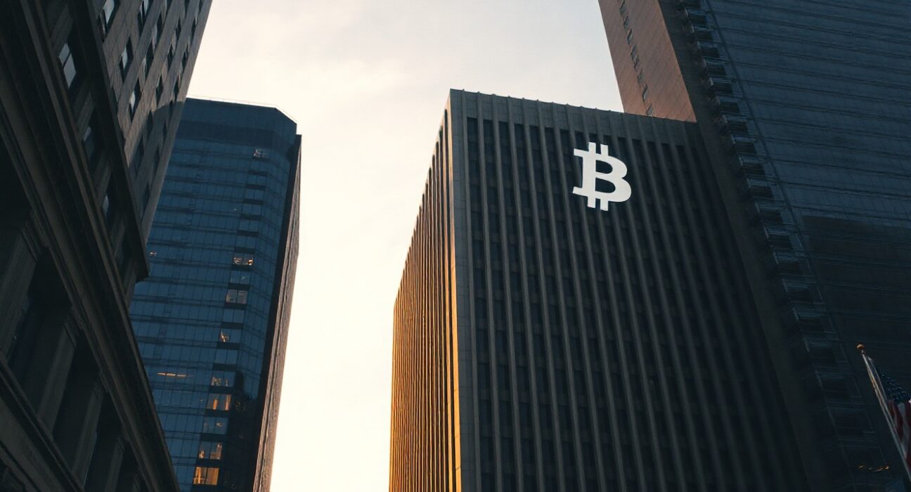 Modern financial building with a digital Bitcoin symbol in the sky, representing the Hashdex Bitcoin ETF closure