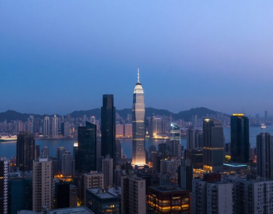 Hong Kong skyline at dusk with harbor and business district, representing economic activity.