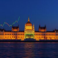 HUF market repricing analysis: Hungarian Parliament building with financial charts representing stable monetary policy outlook by Commerzbank