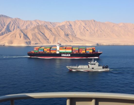 Indian ship transiting the Strait of Hormuz near Iranian coastline, representing the diplomatic denial of payment for safe passage.