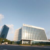 Bank Indonesia headquarters in Jakarta under a clear sky, representing monetary policy and financial stability.