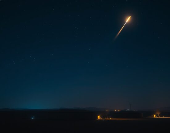 Night scene of a military base in the Middle East with an interceptor missile streaking into the sky