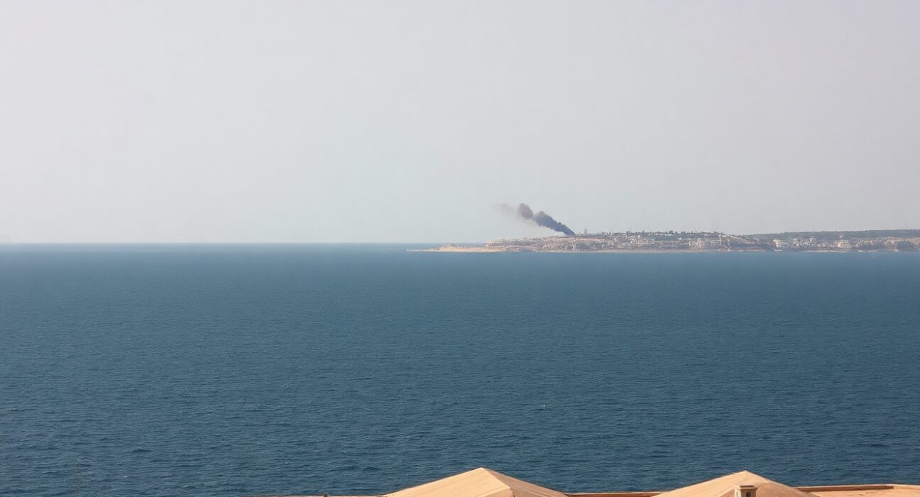 Smoke rising from Qeshm Island coastline after US military strikes, Iran
