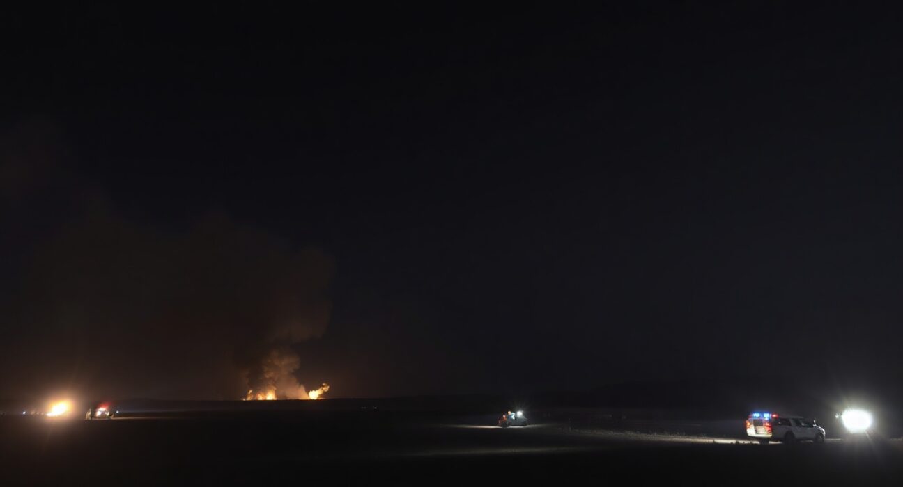 Night sky illuminated by explosions near a military base in the Persian Gulf region