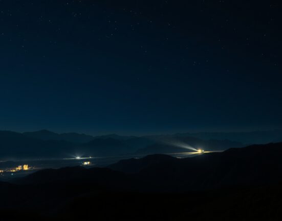 Breaking news image of military tensions in western Iran following Israeli strikes.