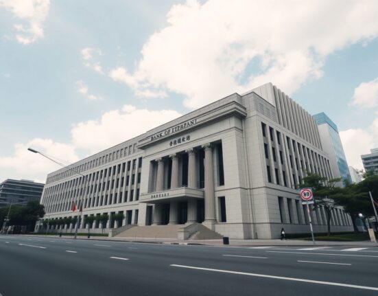 Bank of Japan headquarters in Tokyo on a clear day, representing monetary policy.