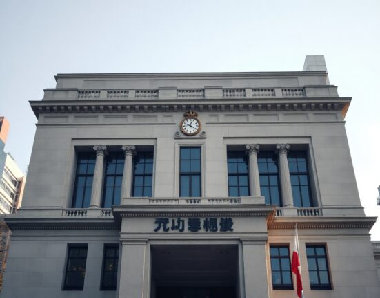 Bank of Japan building in Tokyo under clear sky, representing monetary policy impact on Bitcoin markets.