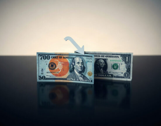 Japanese yen and US dollar banknotes arranged on a reflective surface, with yen slightly lower, symbolizing depreciation